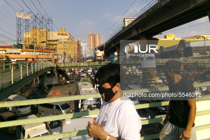 Vehicle congestion builds up along EDSA in Quezon City, east of Manila, Philippines, 14 March 2020, as Filipinos attempt to travel at the la...