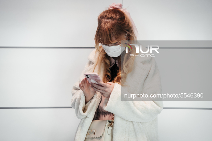 Person wearing protective mask at Helsinki Airport in Vantaa, Finland, during the coronavirus pandemic on March 13, 2020. (Photo by Antti Yr...