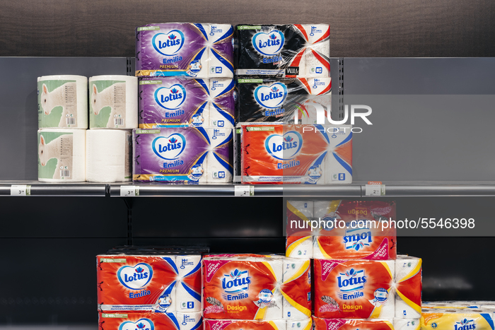 Some packages of paper towels still remain at a supermarket store in Helsinki, Finland, on March 13, 2020.  Empty toilet paper shelves have...
