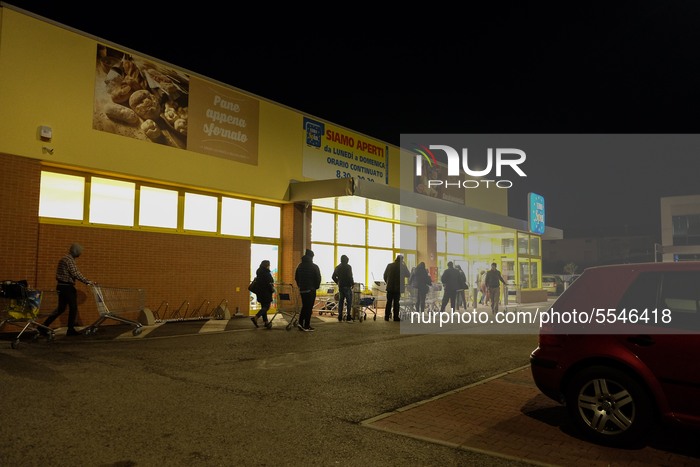 Shoppers wait in line for a supermarket in Lanciano, Italy, on March 14, 2020. (Photo by Federica Roselli/NurPhoto)