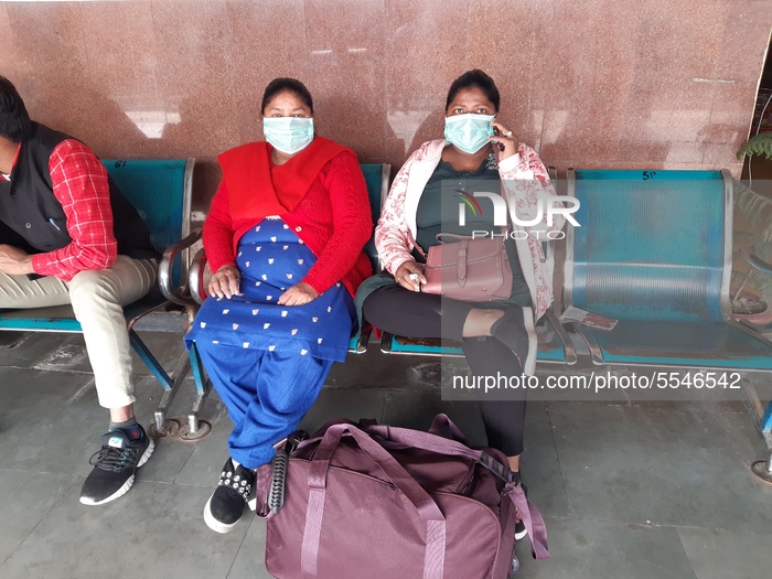 Railway Passengers wearing masks as precautionary measure against COVID-19 at a government run hospital in Moradabad, Utter Pradesh, India,...
