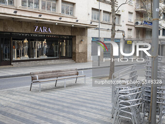 Zara shop closed and empty streets after the state of alarm imposed by the spanish government and measure of lockdown the population of Cata...