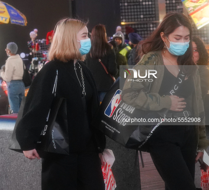 Girls wearing protective facemasks in the Time Saure amid fears of the spread of the COVID-19 novel coronavirus, on March 14, New York City,...