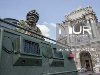Armored car Ukrainian KrAZ production with the soldiers of the Security Service of Ukraine on the background of the opera house In the days...