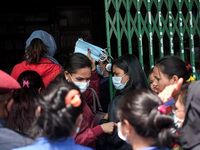 People come out from  a medical store after buying face masks amid concerns about the spread of coronavirus, COVID-19 disease outbreak, in K...