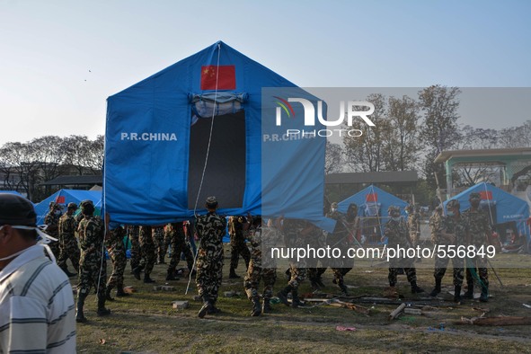 KATHMANDU, NEPAL - Nepalese army personals perpaer tent for the earthquake victims in the camp in Kathmandu, May 1, 2015. 
