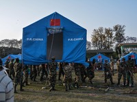 KATHMANDU, NEPAL - Nepalese army personals perpaer tent for the earthquake victims in the camp in Kathmandu, May 1, 2015. (