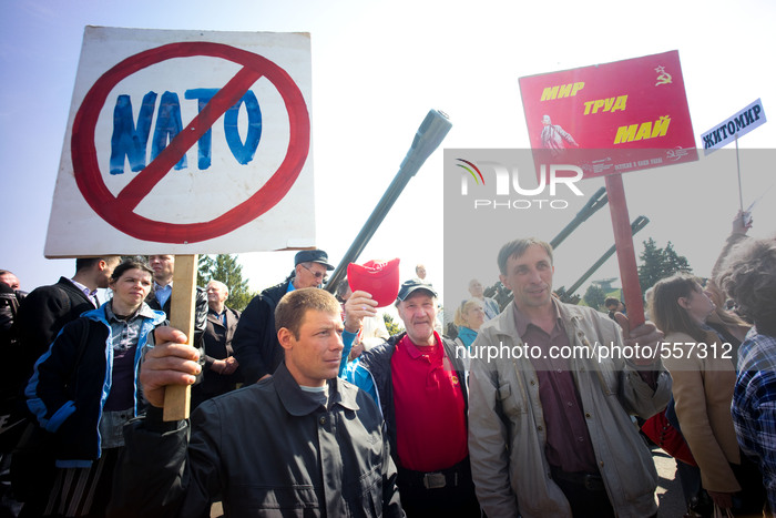 Communist party supporters express their anti NATO view with their placards. - Hundreds of Ukrainian Communist Party supporters attened the...