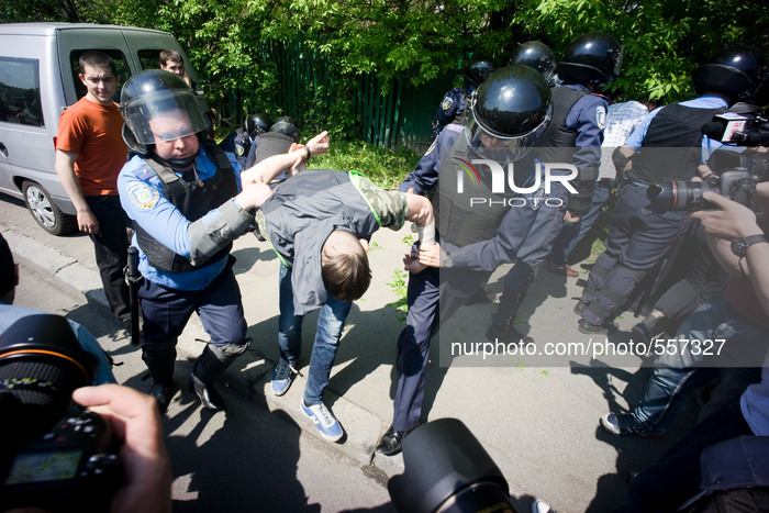 Police arrest a member of the right sector as he tries to disturb the rally held by the communist party. - Hundreds of Ukrainian Communist P...