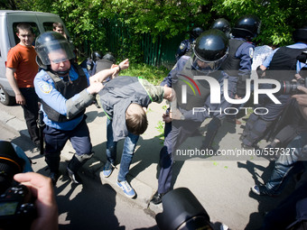 Police arrest a member of the right sector as he tries to disturb the rally held by the communist party. - Hundreds of Ukrainian Communist P...