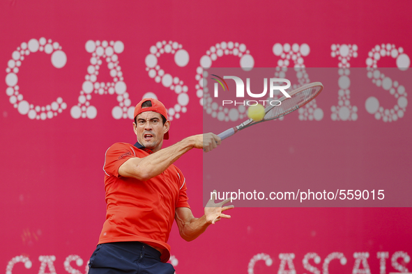 Spanish tennis player Guillermo Garcia-Lopez returns a ball to French tennis player Richard Gasquet during their Millennium Estoril Open ATP...