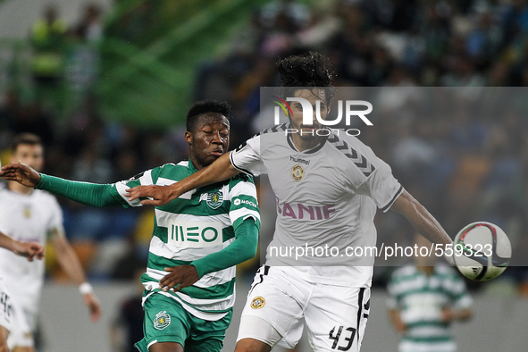 Sporting's forward Carlos Mane (L) vies with Nacional's defender Leandro Freire during the Portuguese League football match between Sporting...