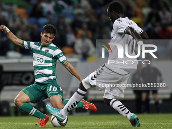 Sporting's Colombian forward Fredy Montero (L) vies with Nacional's midfielder Boubacar during the Portuguese League football match between...