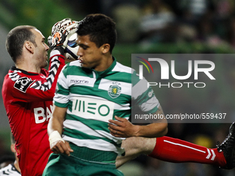 Nacional's goalkeeper Gottardi (L) vies with Sporting's Colombian forward Fredy Montero during the Portuguese League football match between...