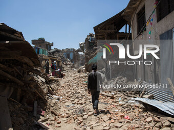 View from the destroy small village of Sankhu near Kathmandu city as a man walk through the rubbles.
Nepalese earthquake survivors outside K...