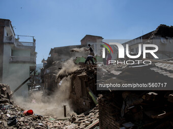 Local people are throwing rubbles as they try to clean their collapsed house in the small village of Sankhu outside Kathmandu.
Nepalese eart...