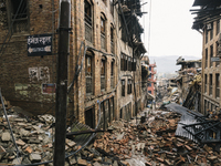 A street covered in the rubble from buildings destroyed by the 2015 Nepal earthquake, Durbar Square, Bhaktapur, Nepal. An earthquake with a...