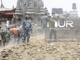 Soldiers from the Nepal Army search through rubble from a temple destroyed by the 2015 Nepal earthquake, Patan Durbar Square, Patan (Lalitpu...