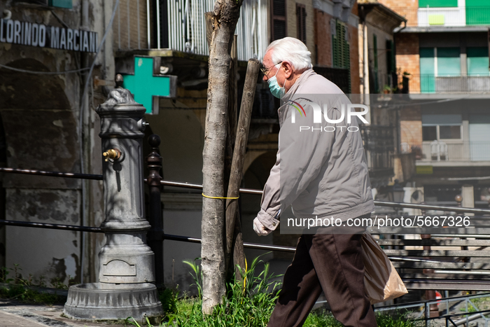 a man holds shopping bags in Lanciano, Italy on April 30, 2020 during the coronavirus emergency (Photo by Federica Roselli/NurPhoto)