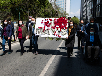Syndicate members holding a wreath in order to lay it on the Taksim square Freedom monument for the May Day celebrations on 1 May, 2020, in...