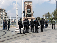 Police officers block the Taksim square Freedom monument for the May Day celebrations  on 1 May, 2020, in Istanbul, Turkey, during the coron...