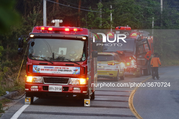 A firefighters Vehicles go a head to bruning forest site  an operation to extinguish a forest fire in Goseong, some 160 kilometers northeast...