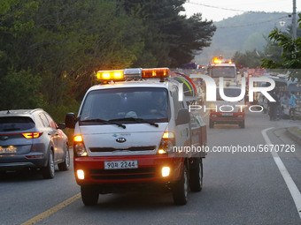 A firefighters Vehicles go a head to bruning forest site  an operation to extinguish a forest fire in Goseong, some 160 kilometers northeast...