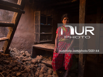Kanchi Achami is sitting inside her destroyed  house. Dhading, Nepal. May 5, 2015 (