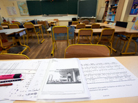 A notebook lies on a table for the respect of the 'sanitary protocols' for pupils  in Toulouse, France on May 6, 2020. Toulouse has begun to...