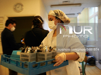 The school's staff clean and disinfect dishes in the canteen before the reopening of the primary school  in Toulouse, France on May 6, 2020....