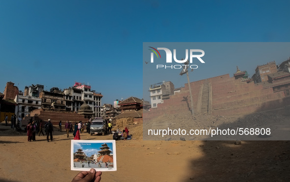 MAY 6, KATHMANDU, NEPAL - A postcard is pictured of Durbar Square,  and behind is the view after the earthquake ofa UNESCO world heritage si...