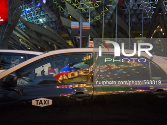 The logo of the Casino Lisboa is reflected in the window of the Taxi in Macao, China , May 2 2015. (