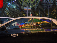 The logo of the Casino Lisboa is reflected in the window of the Taxi in Macao, China , May 2 2015. (