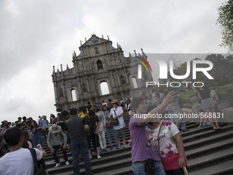 Tourist take selfie picture in front of the Ruin of St. Paul cathedral in Macao, China, May 2 2015. (