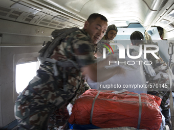 KATHAMNDU, NEPAL-- May 6, 2015--Nepalese Army officials air drop aid to earthquake-affected Sindhupalchok  region from an army plane  to are...