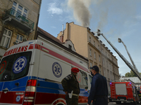 A view of a fire scene with emergency services in action.
Over 50 firemen took part in a firefighting operation in the center of Krakow, jus...