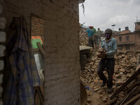 A man is collecting entire bricks from the rubble.
2 weeks after the powerful and deadly earthquake, a view of the oldest city in Nepal, Bak...