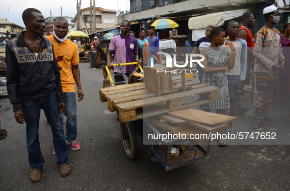 Residents rush to save their belongings as fire razed a market called Olaleye Market in the area somolu area of Lagos State, on May, 30, 202...