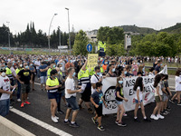 Employees from NISSAN and subcontractors fill a Renault dealership with signs and cut off the access motorway to Barcelona protest in Barcel...