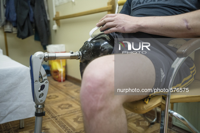 Ukrainian soldier Stuzhenko Vasyl, who lost his arm and a leg during fighting near Illovaisk in the Donetsk region last August wears his new...