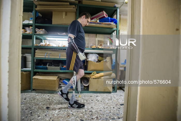 Stuzhenko Vasyl, who lost his arm and a leg during fighting near Illovaisk in the Donetsk region last August, learns to walk with his new bi...