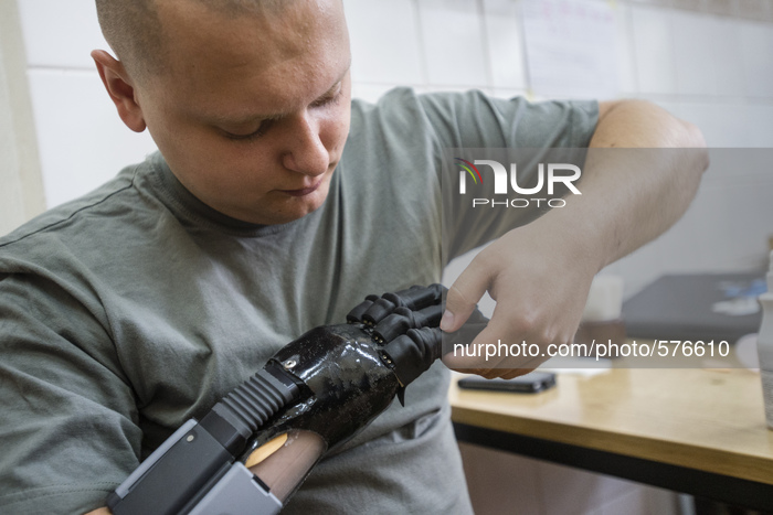 Vlad Kuznetsov, a hero from 95th airborne brigade, is testing his future hand during Ukraine Prosthetic Assistance Project. He saved life of...