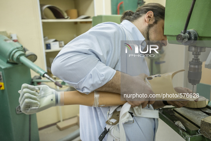 American prosthetist Chris Fantini finishing bionic limb for Vasyl Pelysh during Ukraine Prosthetic Assistance Project. Vasyl lost his hand...