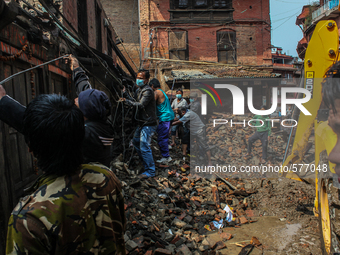 People are repairing damaged electric cables at  Bhaktapur, Nepal, 09 May 2015. (