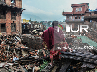 A woman is looking at her broken house at   Bhaktapur, Nepal, 09 May 2015. (