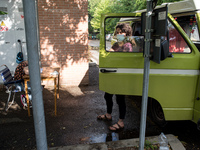 Giulia Zaffagnini, middle school teacher, and one of her pupils during a lesson in a van under the student's house while the schools are clo...
