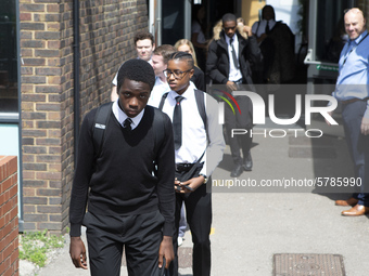   Year 10 pupils walking a long the path to get into the canteen for their break. Ortu Gable Hall School in Corringham, Essex return after a...
