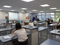  A view of a teacher teaching a class of Year 10 pupils. Ortu Gable Hall School in Corringham, Essex return after a long break due to the CO...