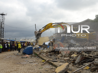 Officials Lagos State Emergency Management demolishing the remains of the building, after a building collapse at Gafari Balogun street, Ogud...