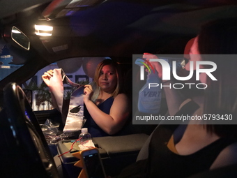 Ciudad Juarez High school students receive their diplomas inside their vehicles at a ''drive in'' graduation ceremony held at the Centro Cul...